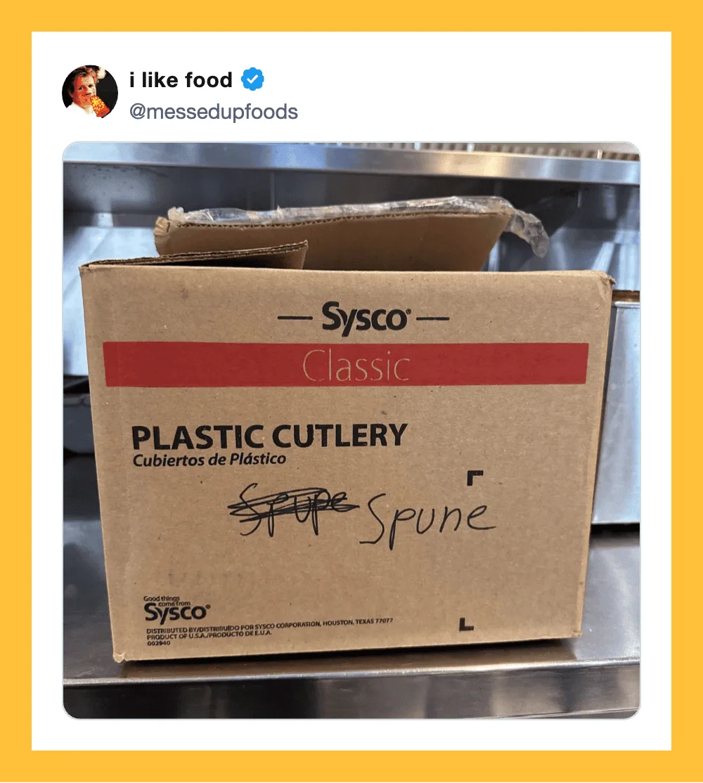 Box of Sysco plastic cutlery with handwritten 'spoon' label on it.