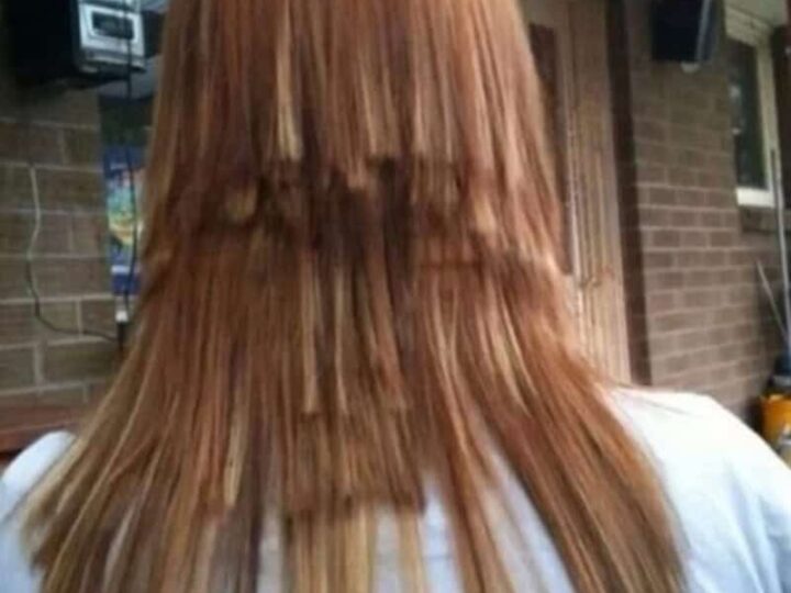 Haircut fails with uneven layering and choppy ends on reddish hair.