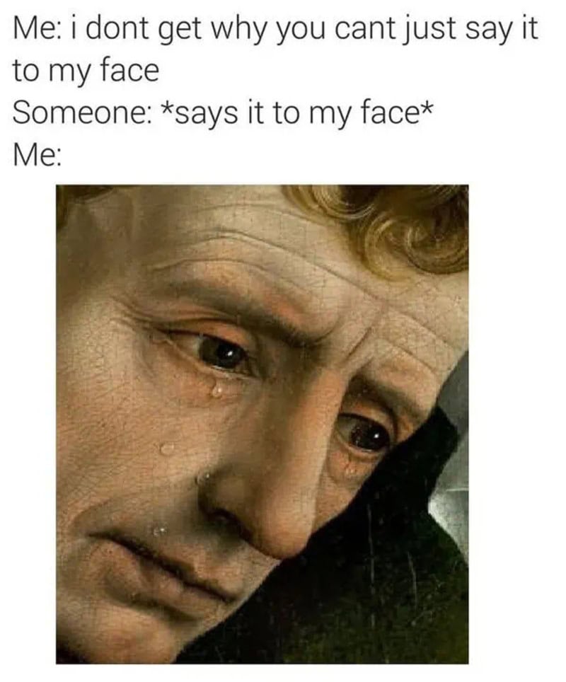 Close-up of a person with a sad expression, tears on face, and a pained look.
