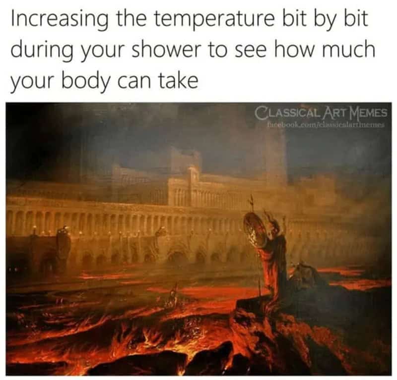 Classical statue in a fiery landscape with a building in the background.