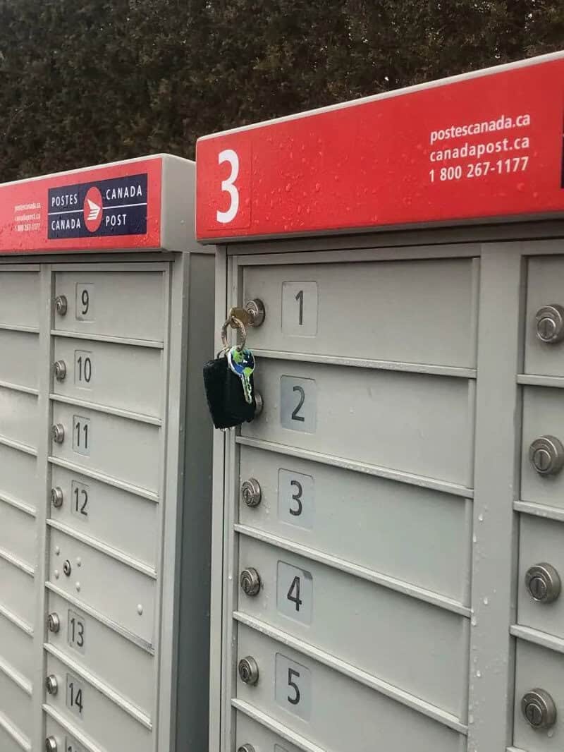 Postes Canada mailbox with lock and key, no mail inside.