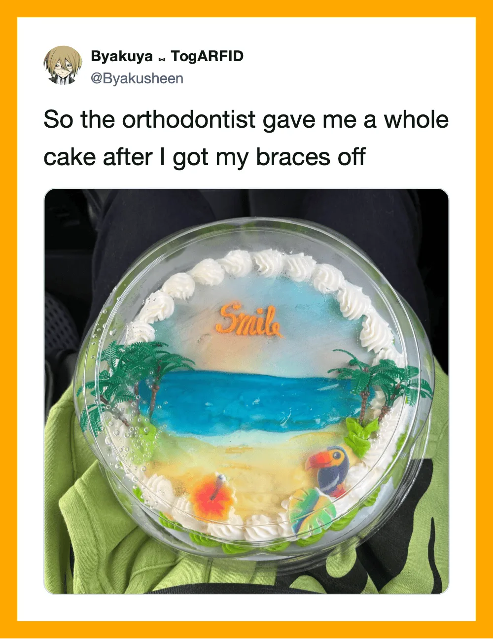 Cake with ocean scene, palm trees, and the word 'Smile' on top.