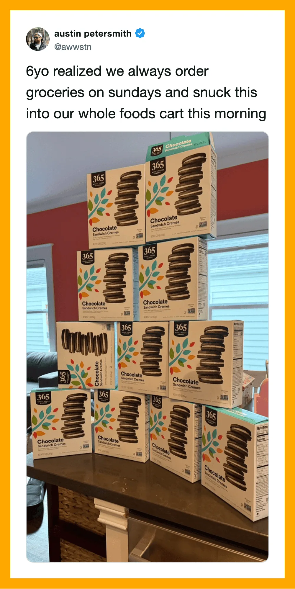 Stacked boxes of 365 Everyday Value chocolate cookies on a kitchen counter.