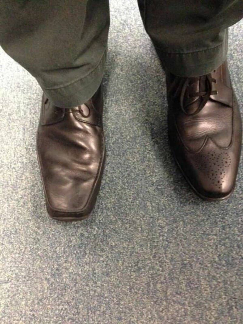Pair of brown dress shoes with a funny crease pattern on the toes.