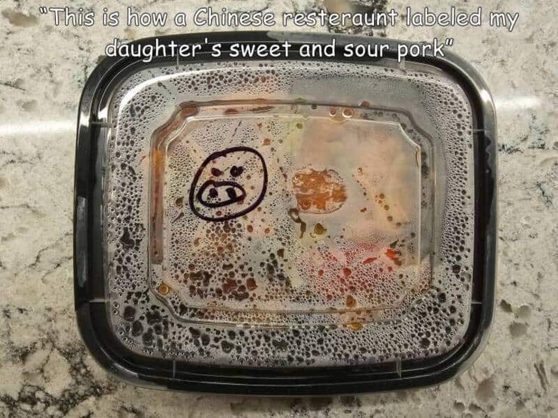 Container with leftover food and a pig face drawing, caption about Chinese restaurant.