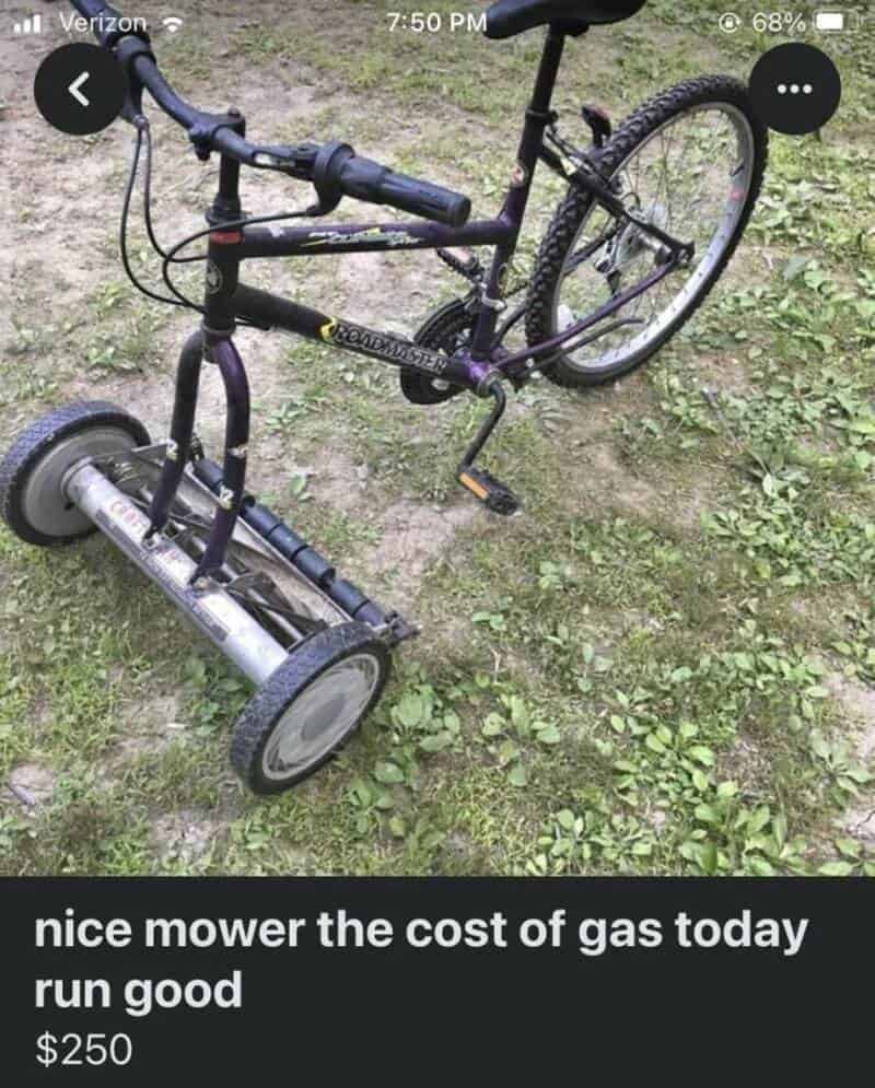 A bicycle with a lawnmower attached as a makeshift motorized bike.