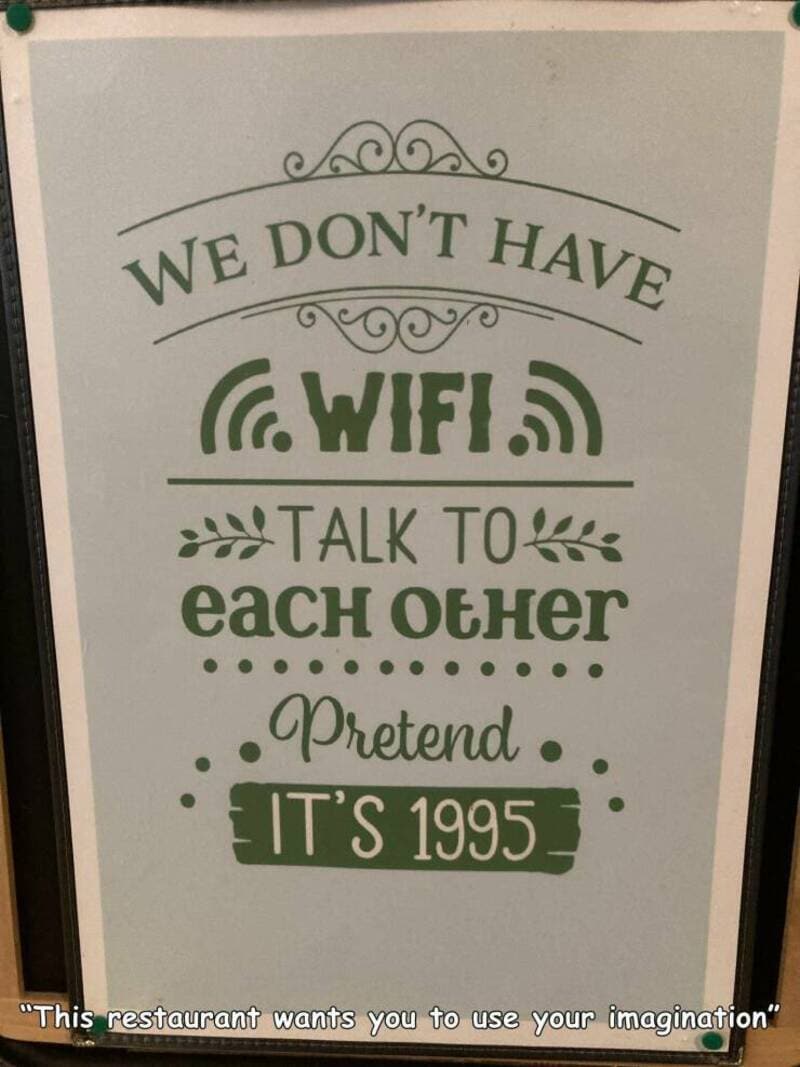 Sign says we don't have WiFi, talk to each other, pretend it's 1995.