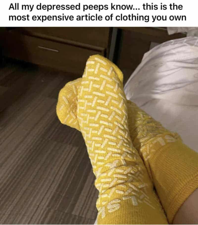 Person wearing yellow patterned socks with the caption about expensive clothing.