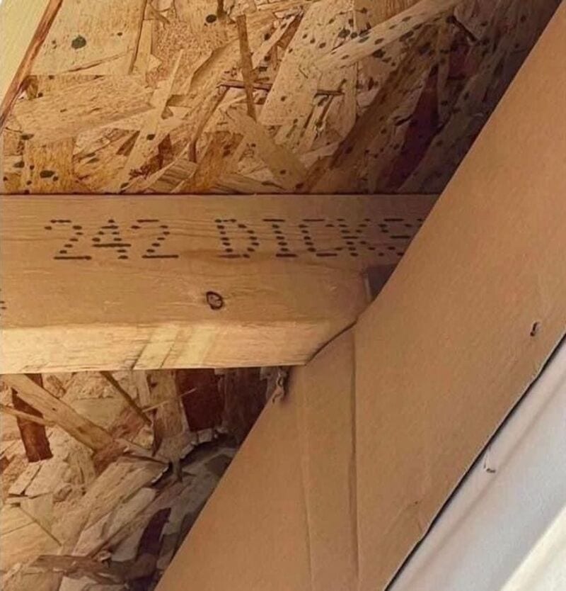 Close-up of a wooden beam with the text 'Z82 BLOCK' stamped on it.