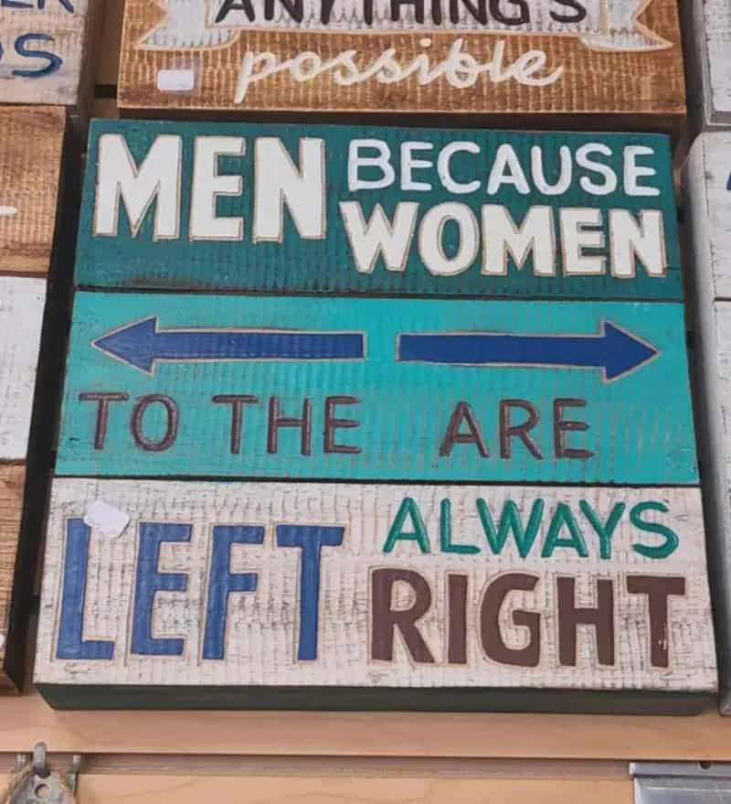 Sign reads 'Men because women to the left always right' with arrows pointing left and right.