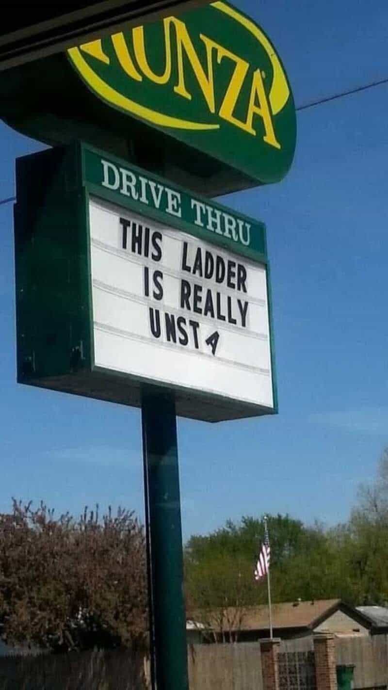 Fünza drive-thru sign with a message about a ladder being unsafe.