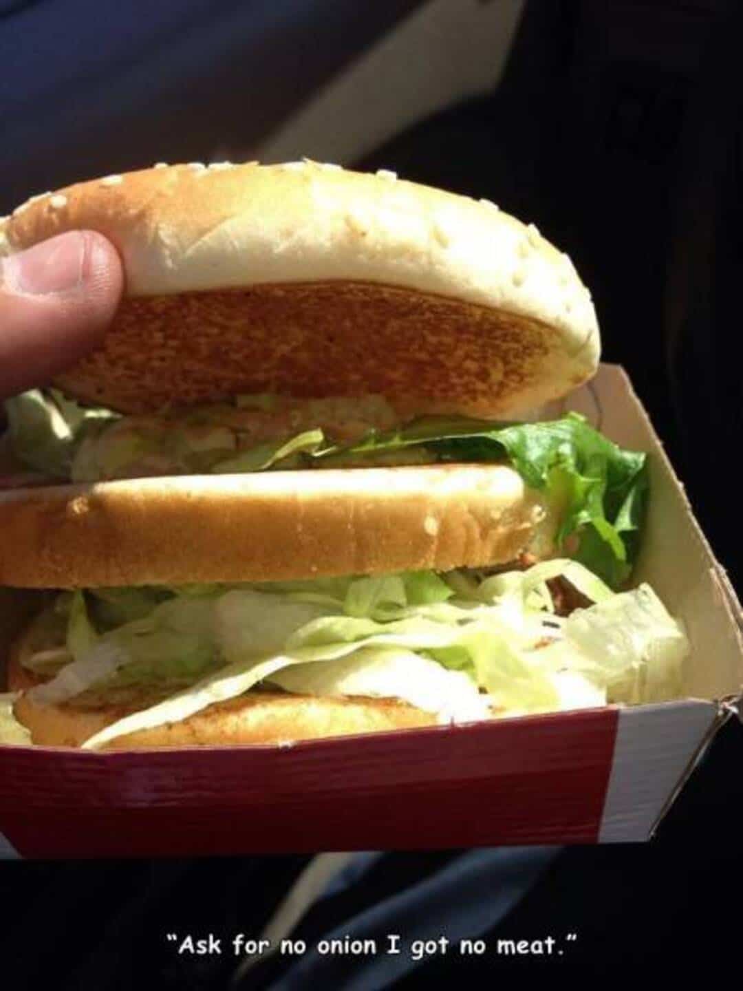 Large sandwich with lettuce, tomato, and bread, with a humorous caption.
