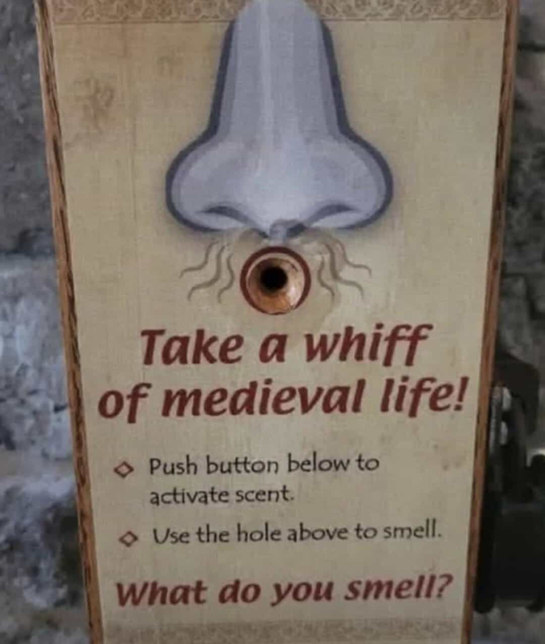 Sign with a nose illustration and instructions to smell medieval scents.