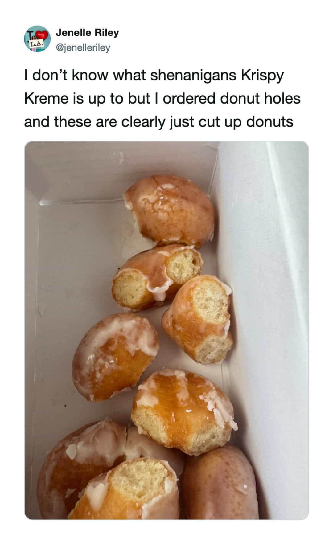 Donut holes with icing, cut up donuts in a box.