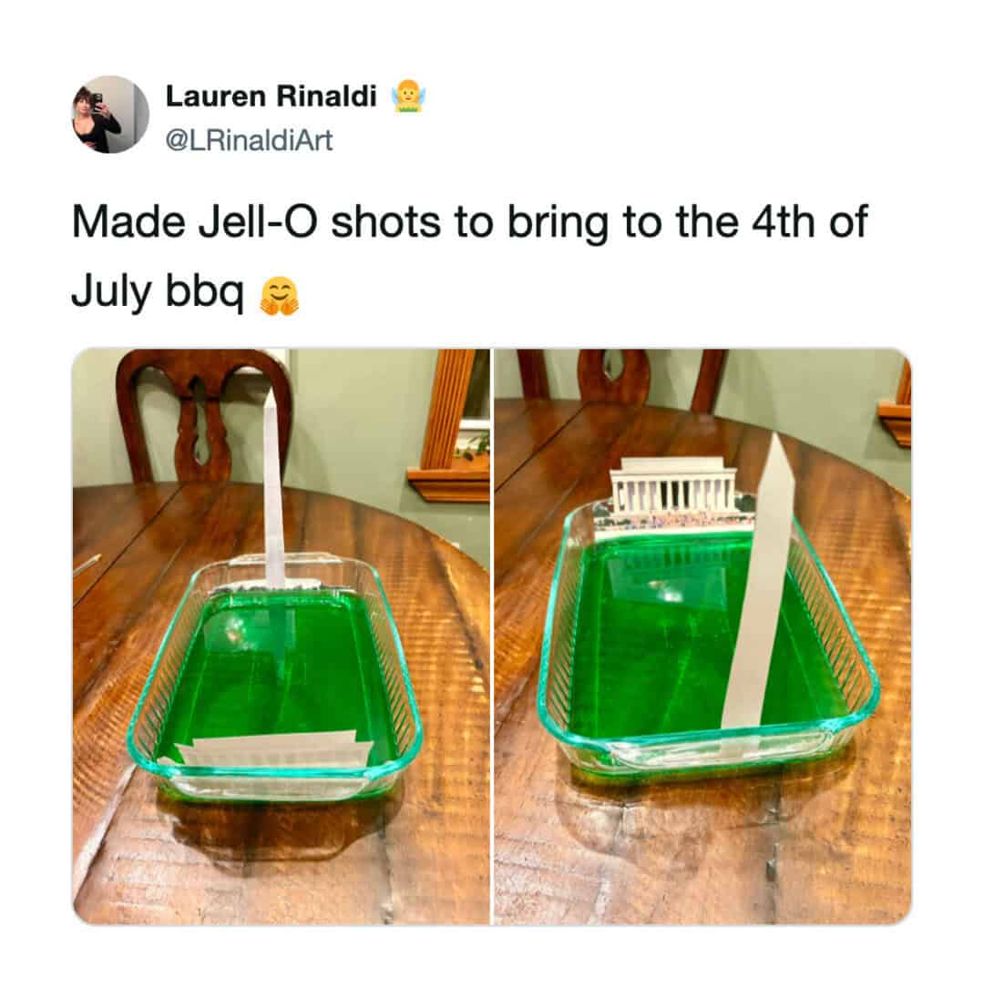 Jell-O shots with a plastic spoon and a small plastic fence in a green Jell-O.