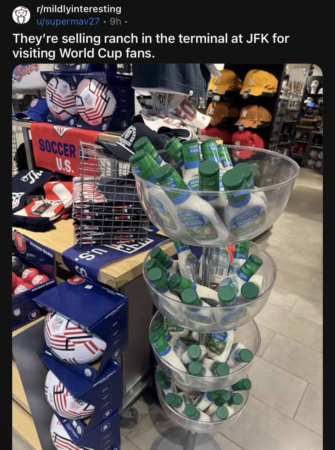 Stacked bowls filled with small green bottles at a store.