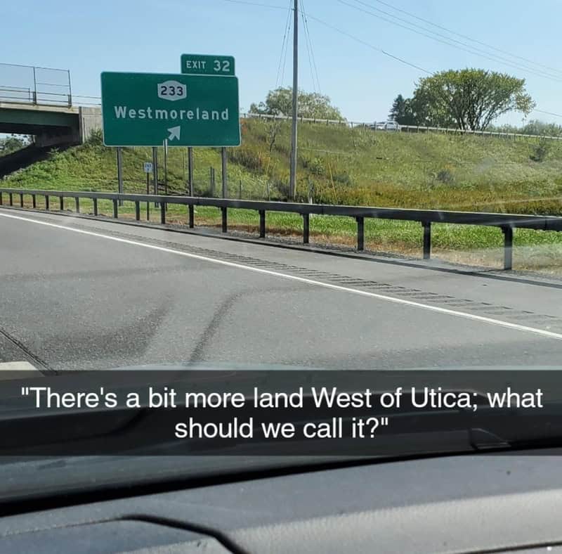 Road sign for Westmoreland exit on highway, with humorous caption about land west of Utica.