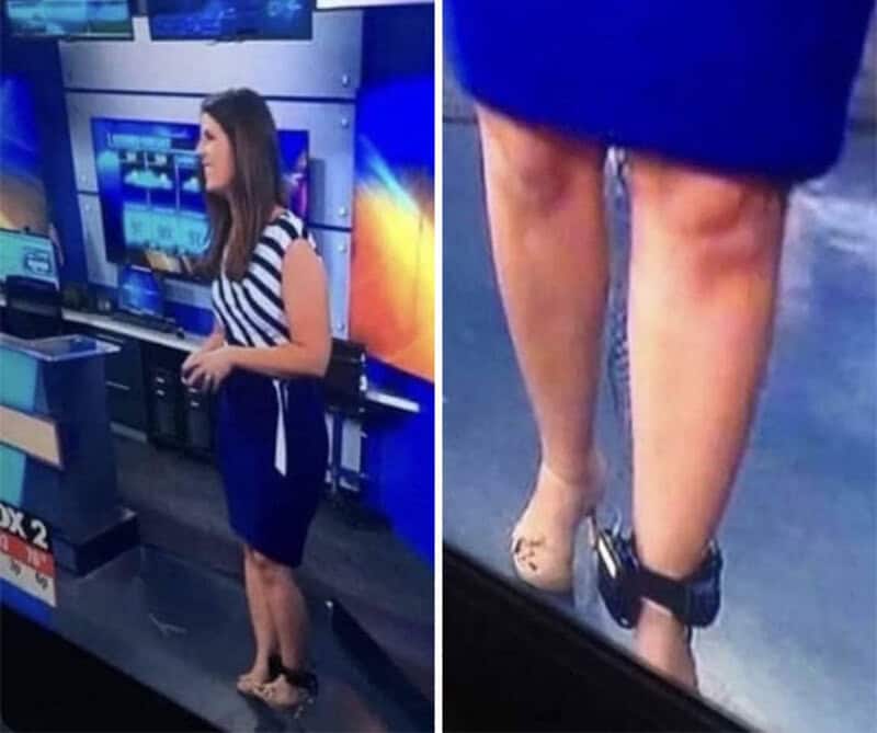 Woman in a striped top and blue skirt with her ankles chained to a metal object.
