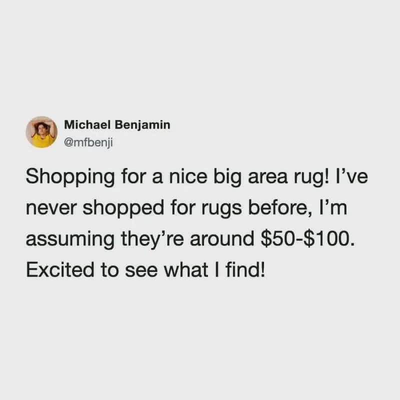 Person shopping for a large area rug, excited to see what they find.