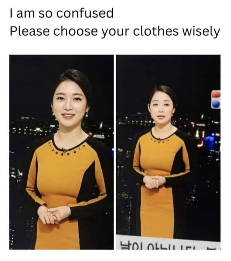 Confused woman in yellow and black dress with night city background.