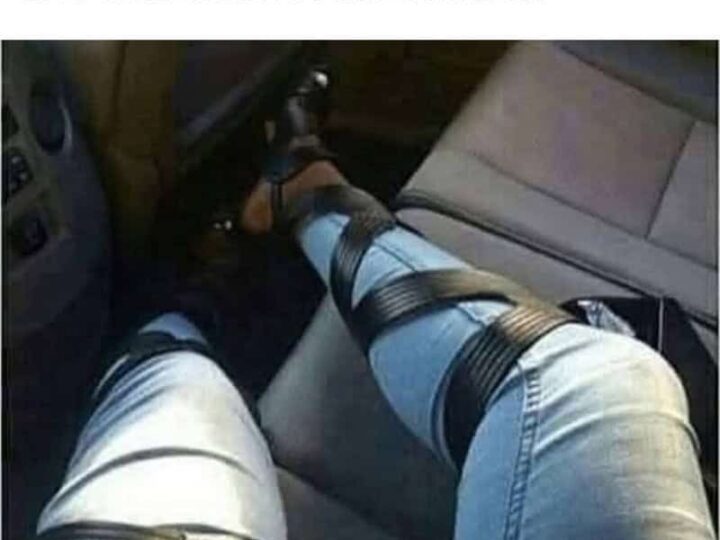 Person's legs tied with black straps in a car seat, caption about shoes and seatbelt.