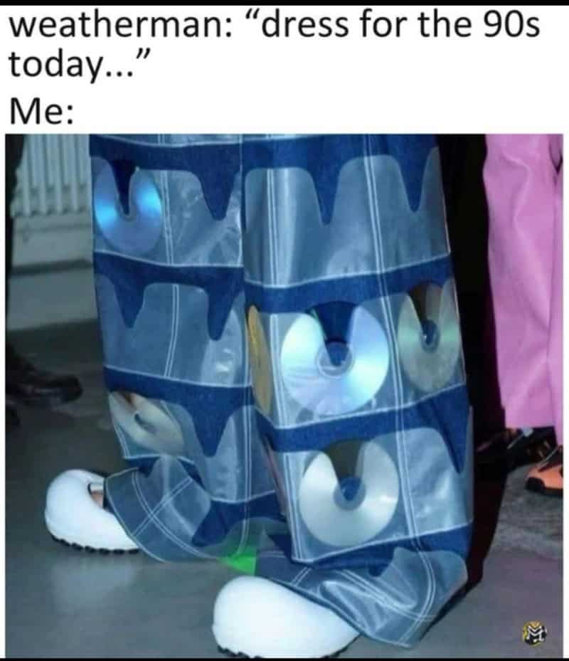 Person wearing 90s style baggy pants with speakers attached, caption about dressing for the 90s.