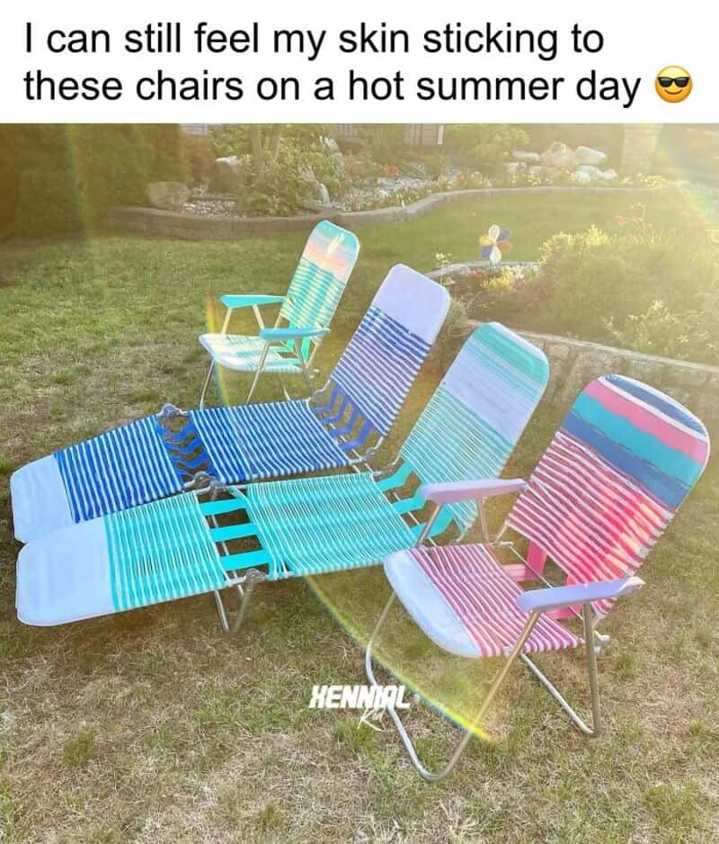 Four colorful outdoor chairs with striped fabric, on a grassy lawn.