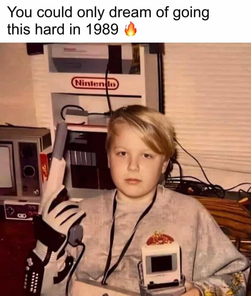 Child with a robotic arm and a portable gaming device in 1989.