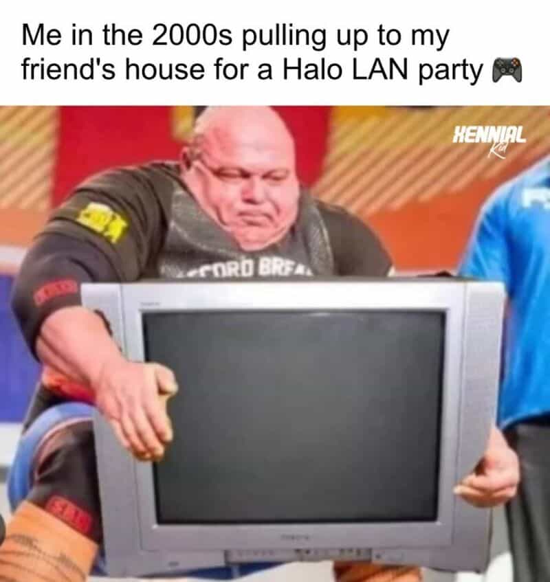 2000s kid pulling a CRT monitor for a Halo LAN party, with humorous expression.