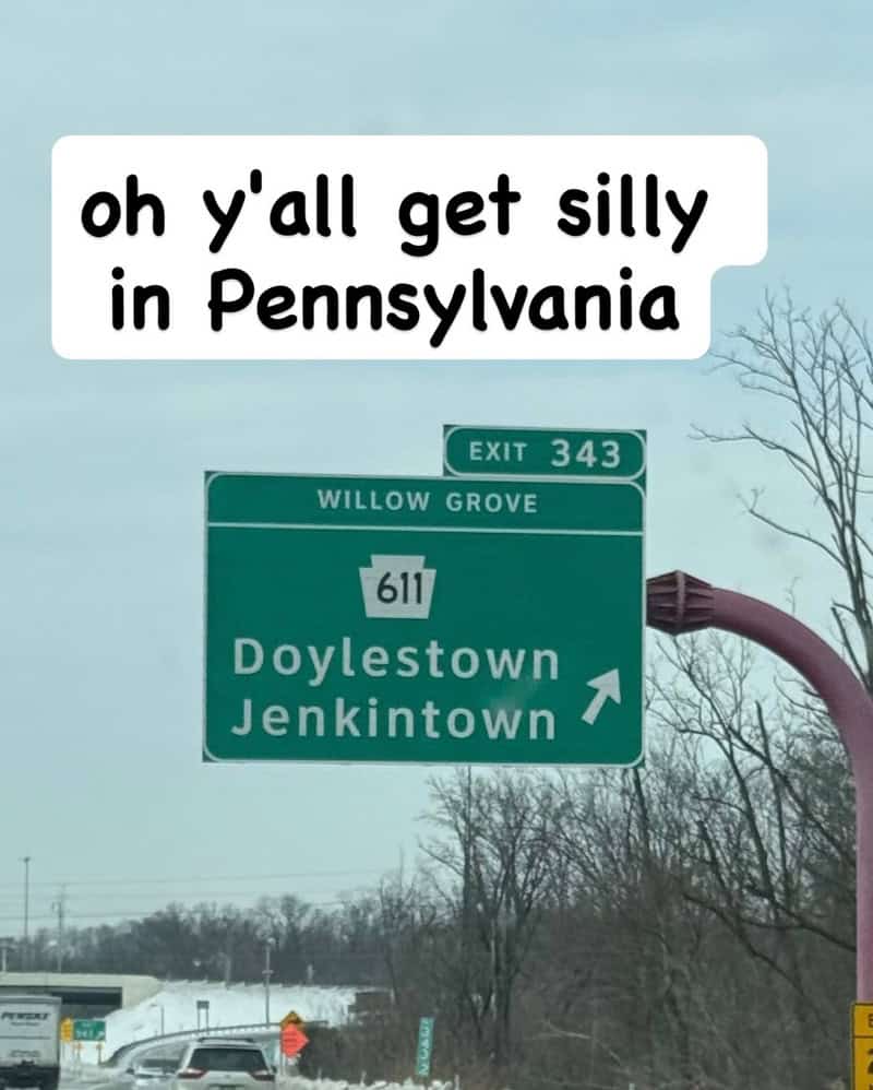 Sign pointing to Doylestown and Jenkintown in Pennsylvania with humorous caption.