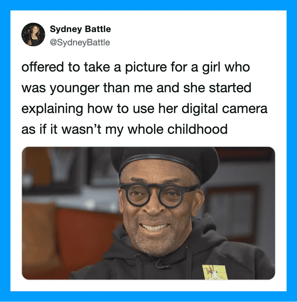 A man with glasses and a black beanie smiling in a photo from a tweet.