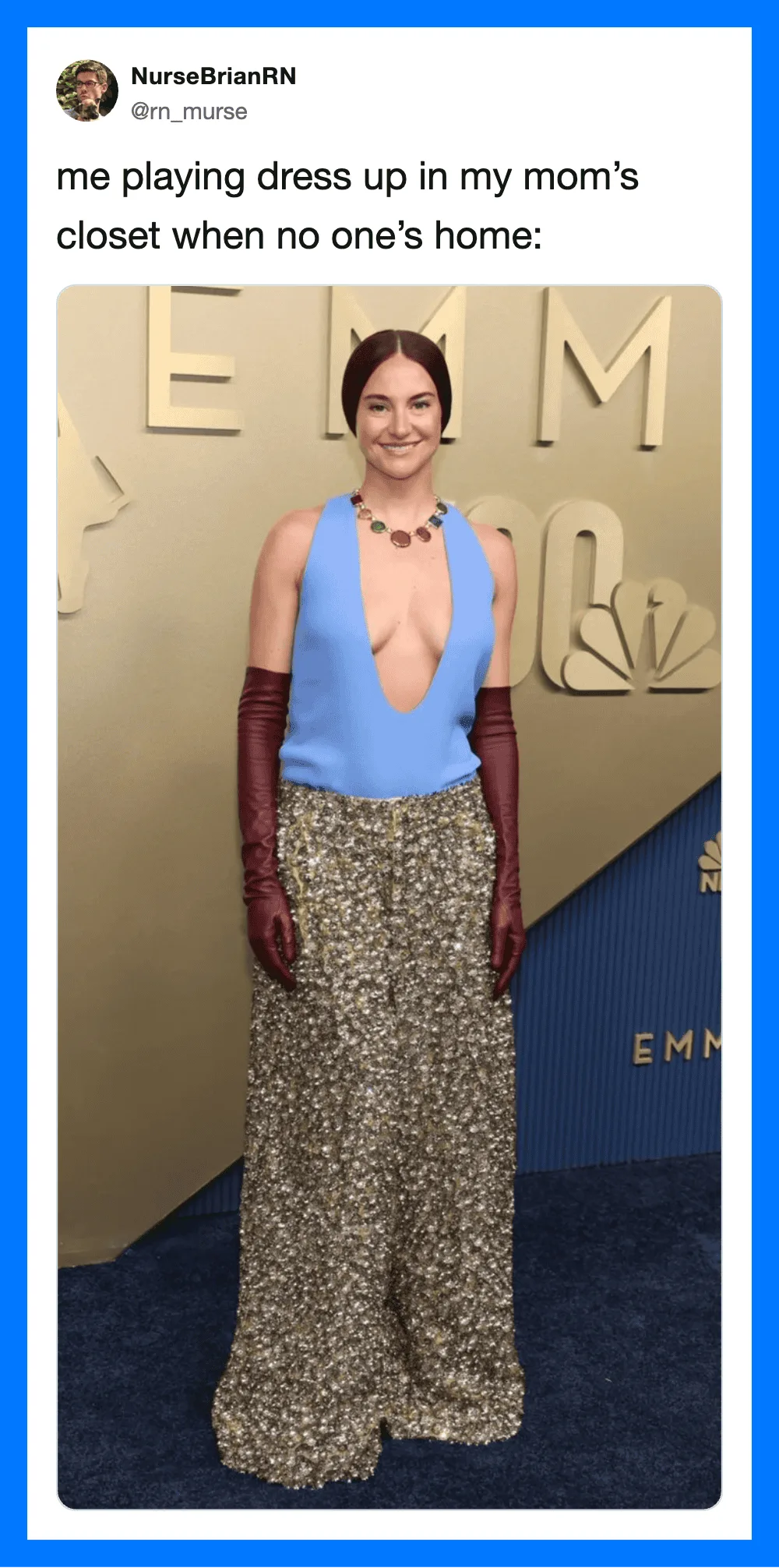 Woman in blue top and patterned pants with long gloves at an event.