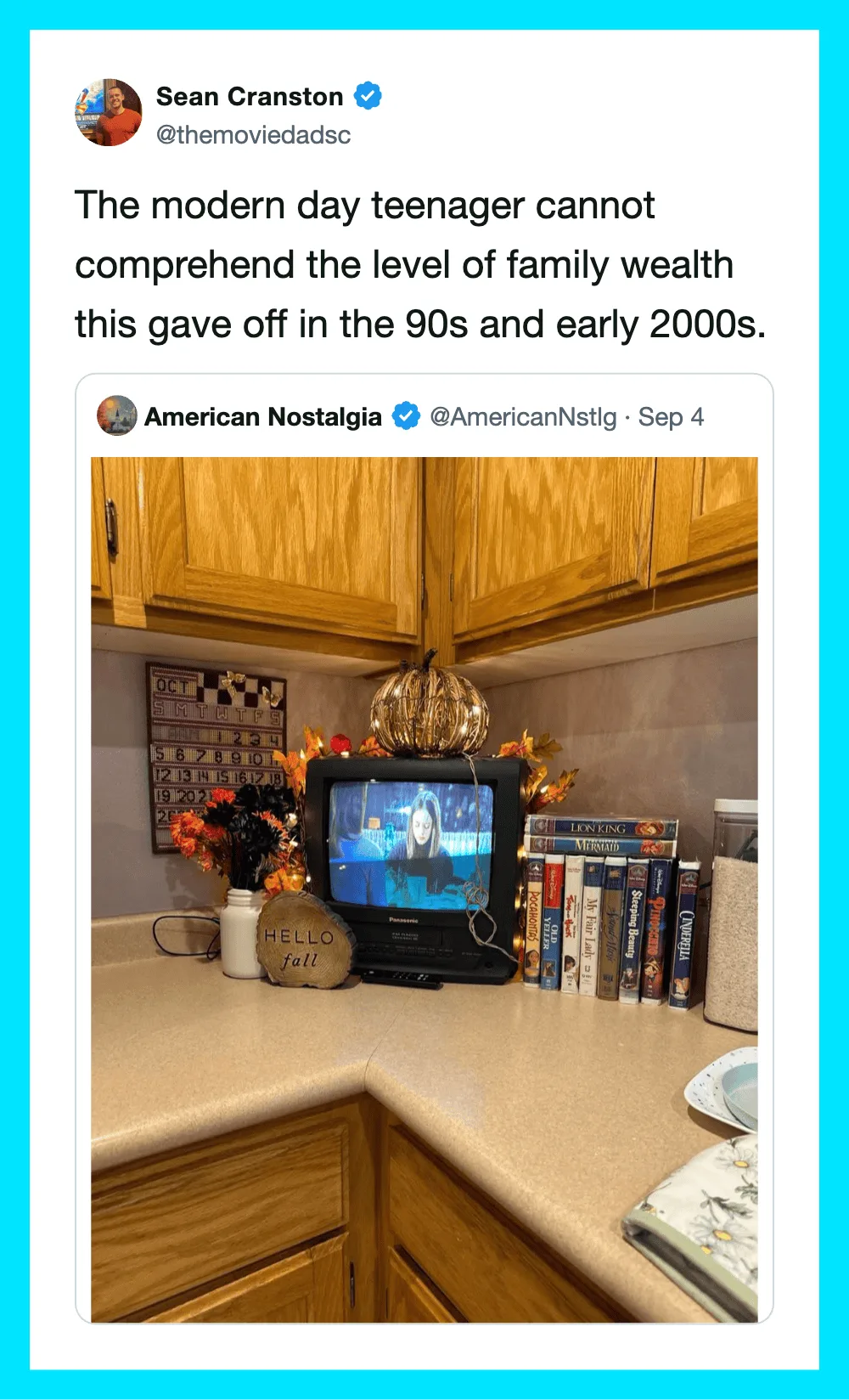A small TV on a kitchen counter showing a video call, surrounded by books and decorative items.