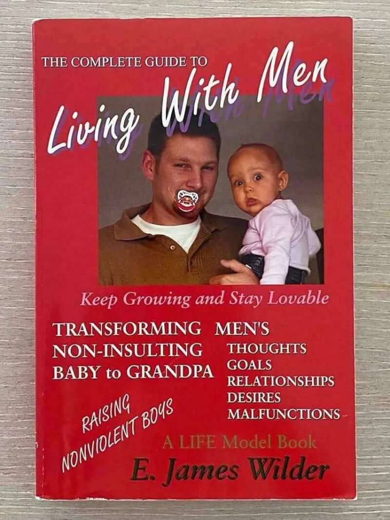 Book cover titled 'Living With Men' by E. James Wilder, featuring a man and a baby.