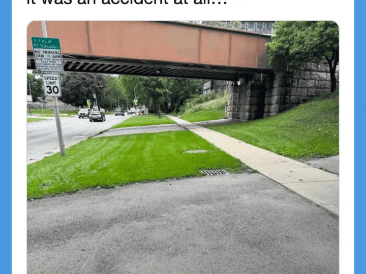 Scooter accident scene with banana peels on the ground under a bridge.