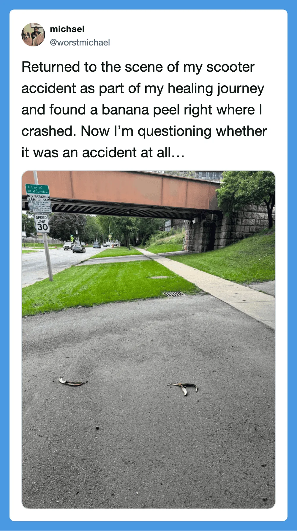 Scooter accident scene with banana peels on the ground under a bridge.
