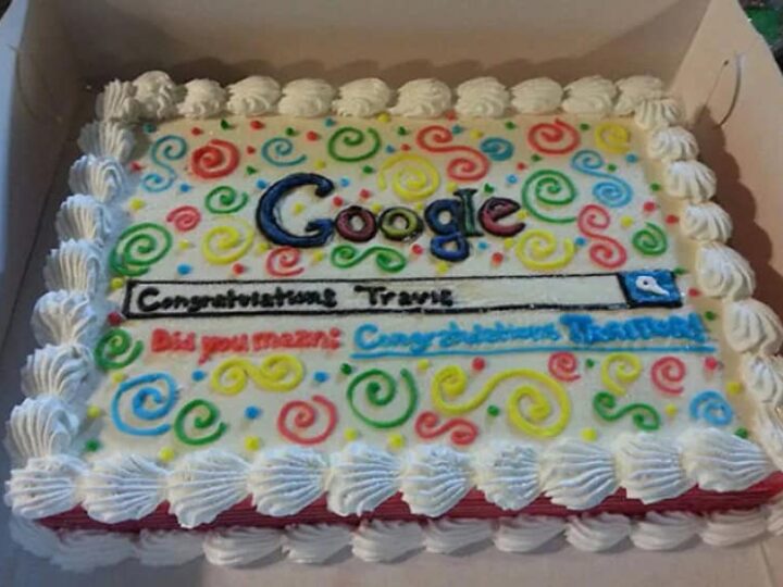 Celebration cake with colorful swirls, 'Google' logo, and congratulatory message.