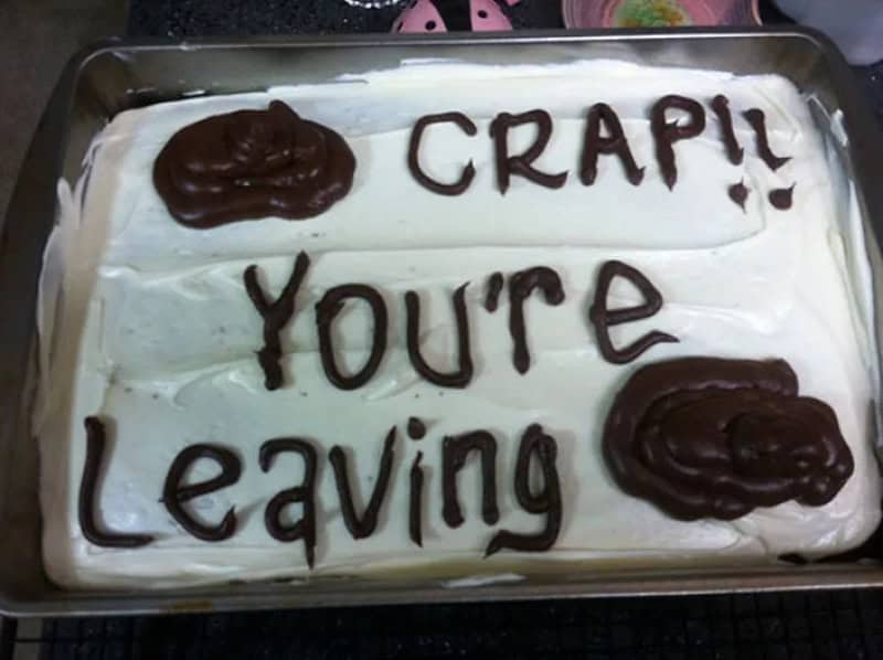 Cake with message 'CRAP!! You're Leaving' written in chocolate.