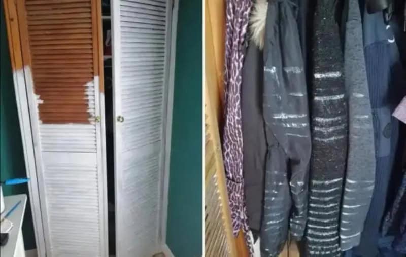 Closet door with broken slats and hanging clothes.