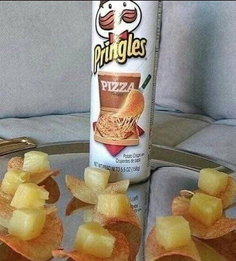 Pringles can with a pizza flavor label and pineapple chunks on chips.