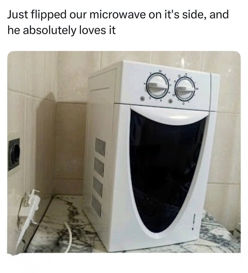Microwave flipped on its side, loved by the person in the image.