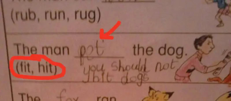Child's handwriting with correction: 'The man got the dog.'.