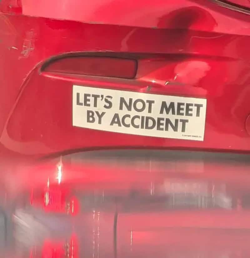 Sticker on red car that says "LET'S NOT MEET BY ACCIDENT".
