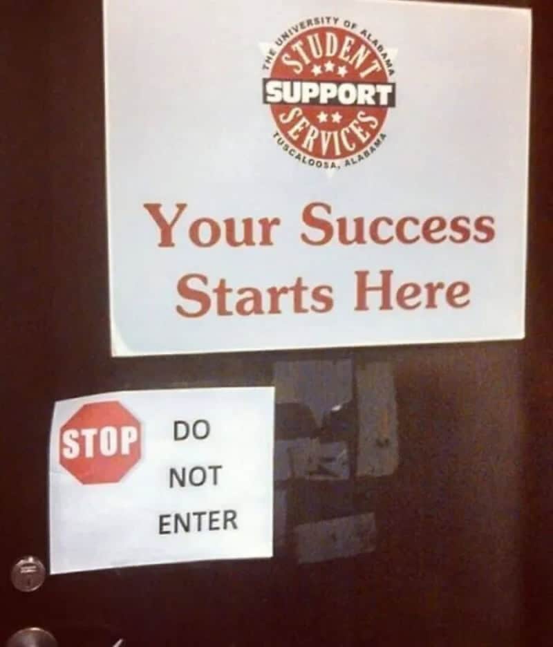 Sign with 'Your Success Starts Here' and a 'STOP DO NOT ENTER' notice.