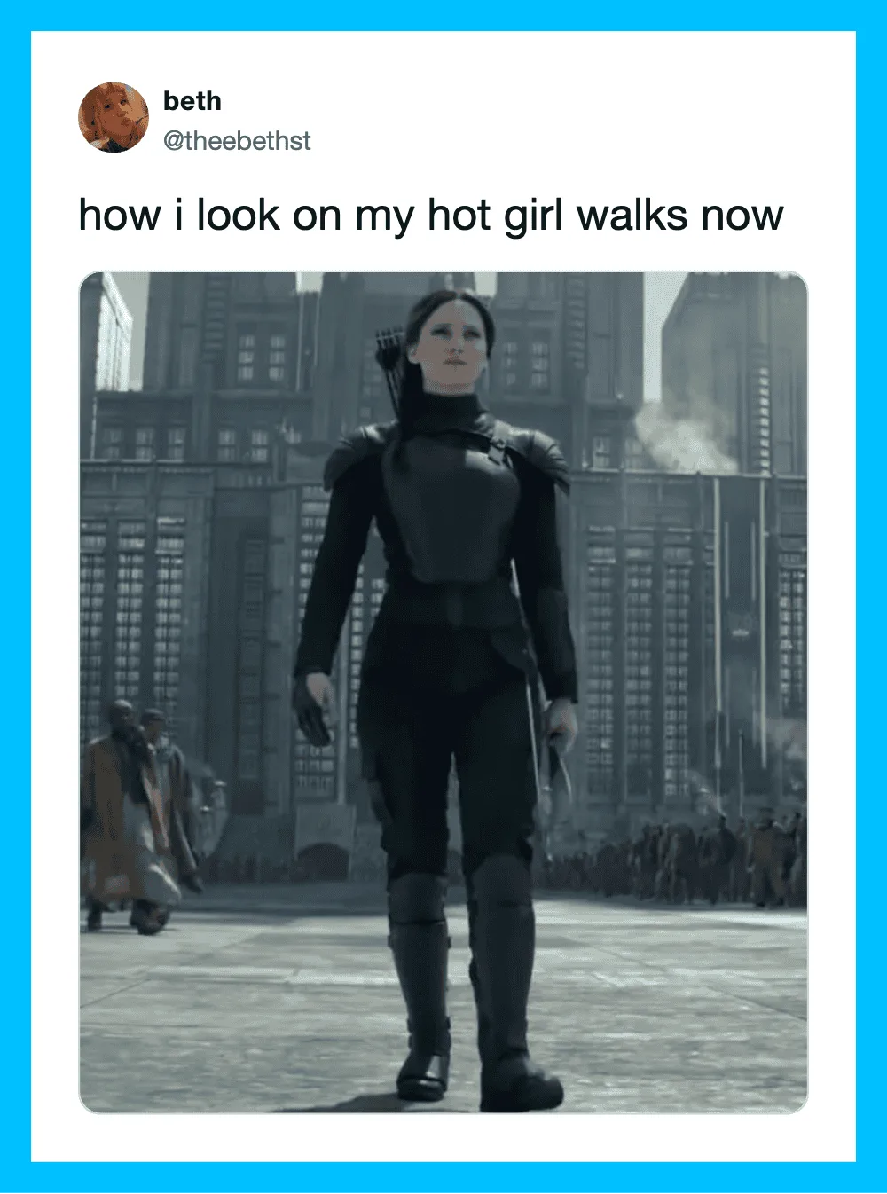 Woman walking confidently in a futuristic cityscape with tall buildings.
