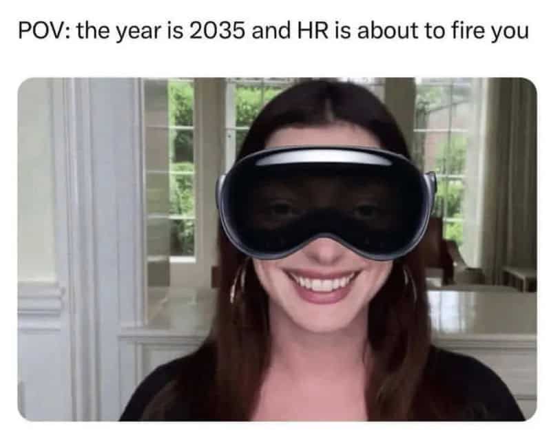 Woman wearing VR goggles smiling in a bright room.