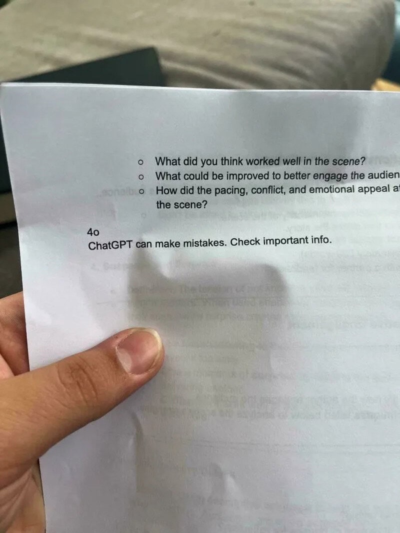 Hand holding a paper with questions about scene analysis and mistakes, with a note about ChatGPT.