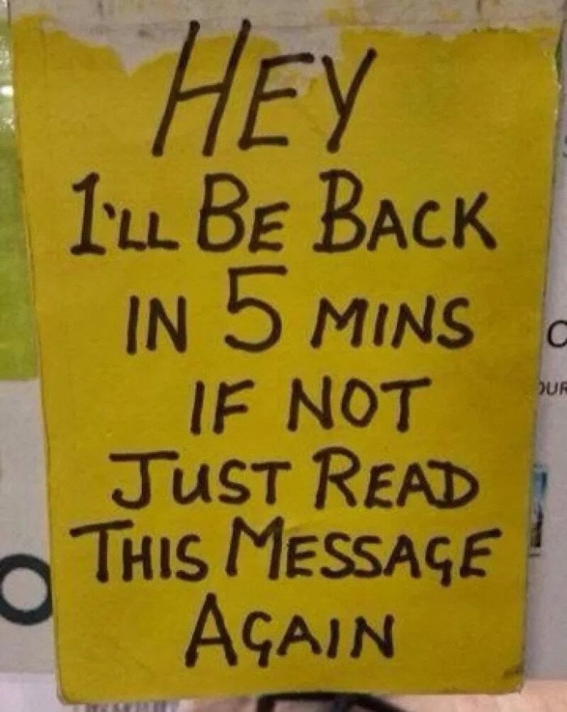 Yellow sign with handwritten message: Hey I'll be back in 5 mins if not just read this message again.