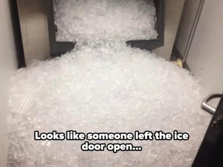 Ice spilled out of the open ice door onto the floor.