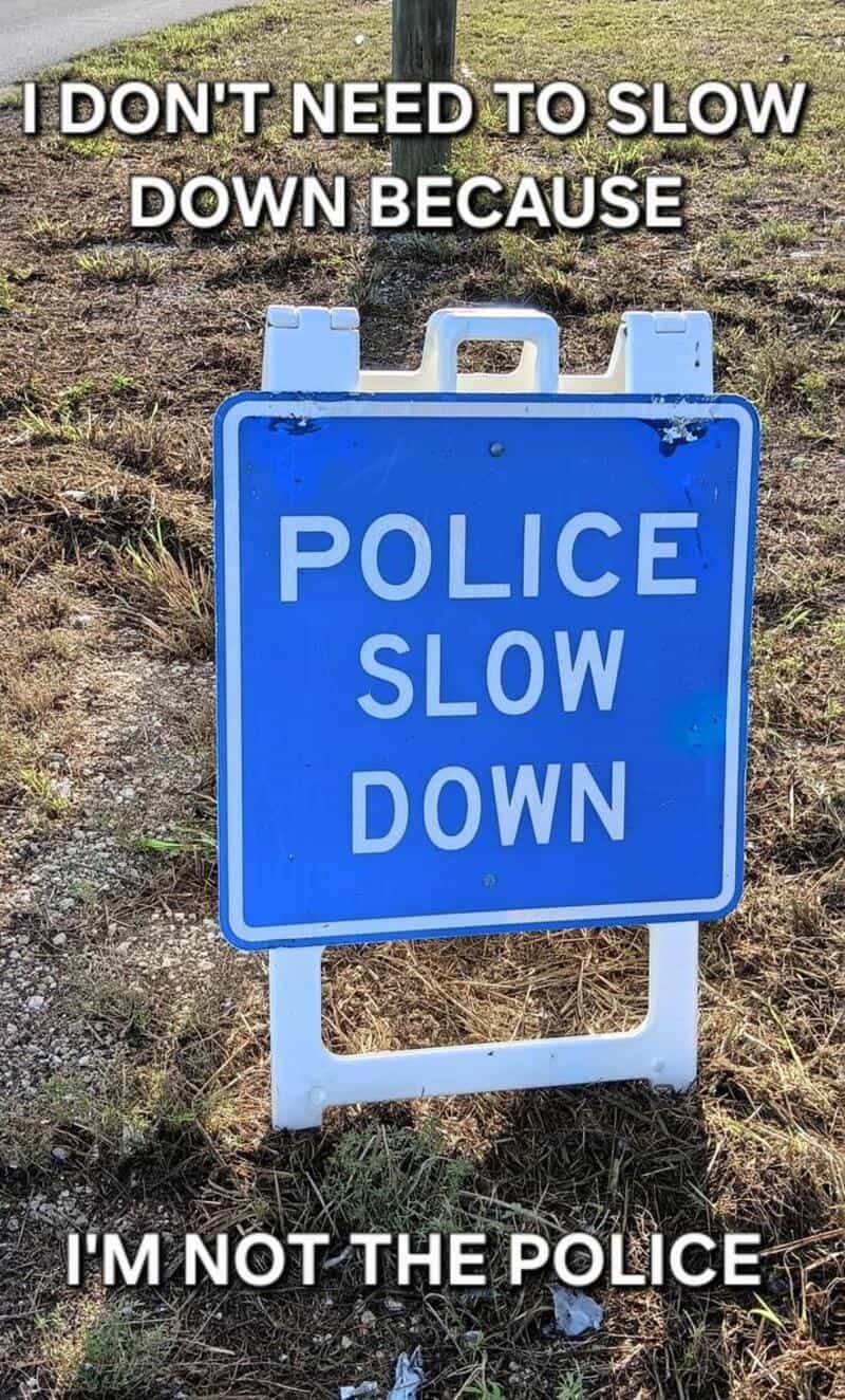 Sign says 'Police Slow Down' with text above and below about not needing to slow down.